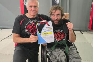 Krav Maga Shuryu Dojo Student Coby who is in a wheel chair