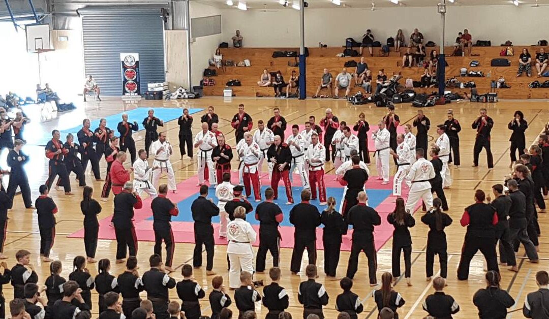 Description: Students showing respect before training begins at a martial arts dojo.